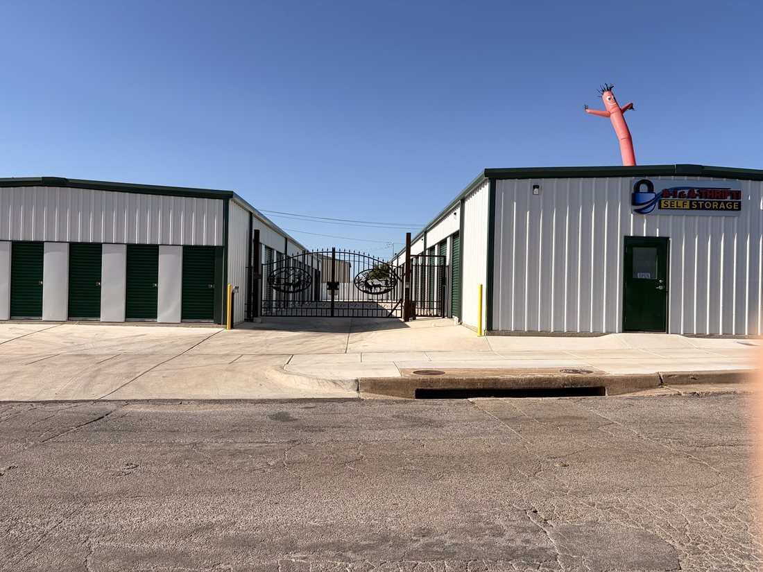 Gated entrance and white storage buildings at A-1 Self Storage on W Pafford Street in Fort Worth, Texas